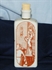 Kép Porcelán flaska metszetes dekorral, barna